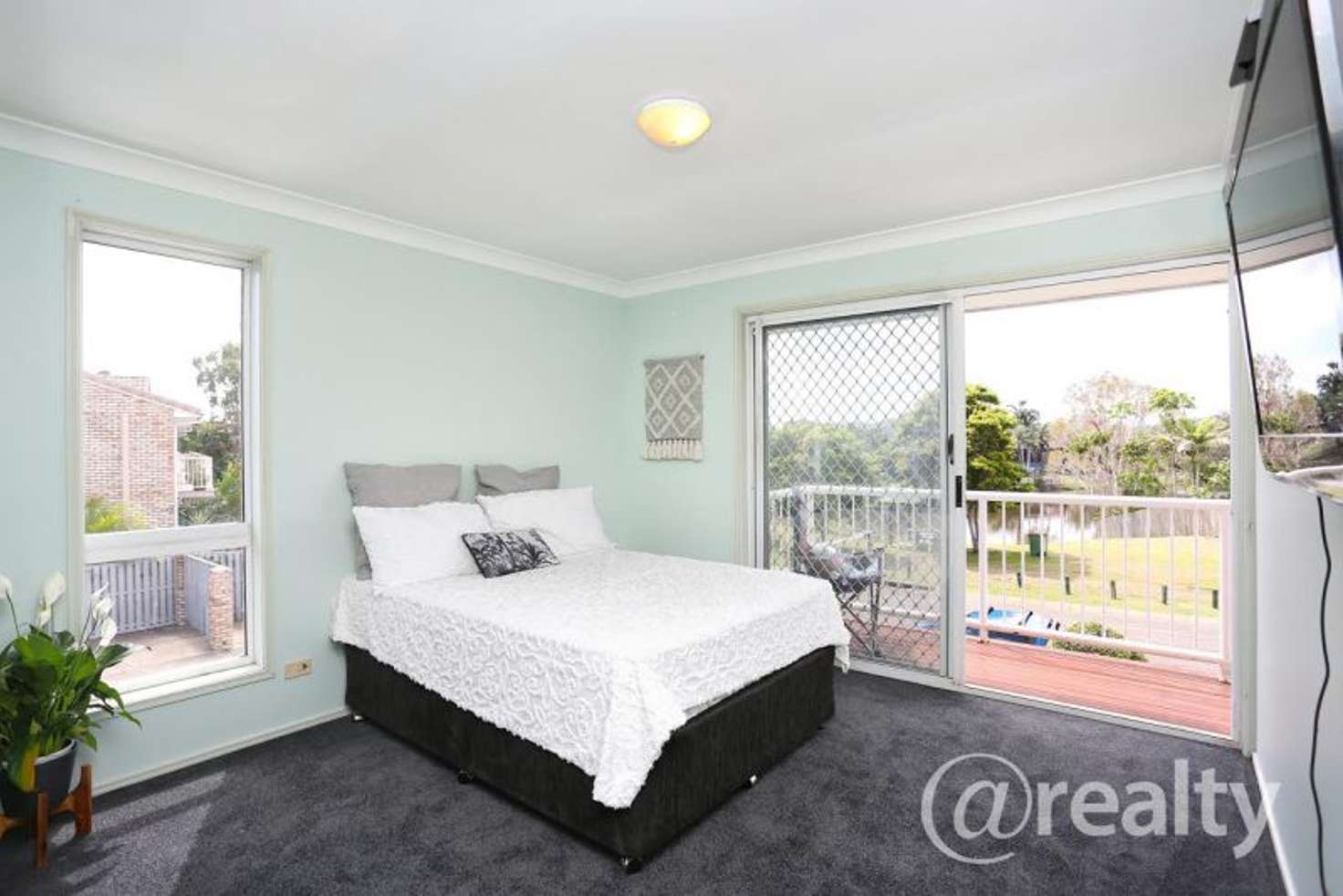 Main view of Homely townhouse listing, 9 Harrier Drive, Burleigh Waters QLD 4220
