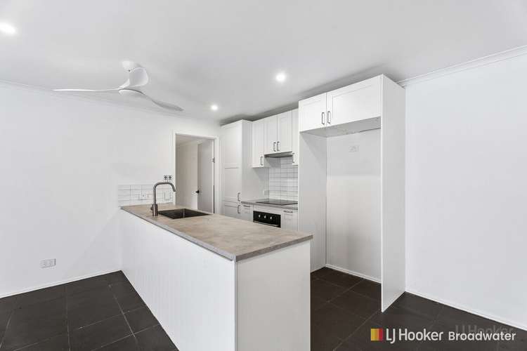 Main view of Homely townhouse listing, 1/49 Morinda Way, Labrador QLD 4215