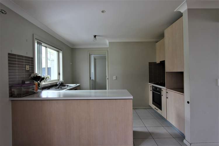 Second view of Homely house listing, 12 Northampton Drive, Glenfield NSW 2167