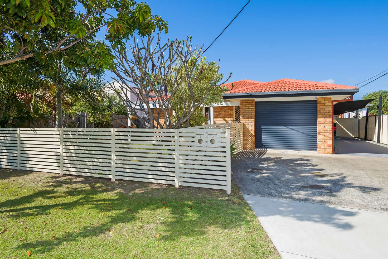 Main view of Homely semiDetached listing, 1/12 Nankeen Avenue, Paradise Point QLD 4216