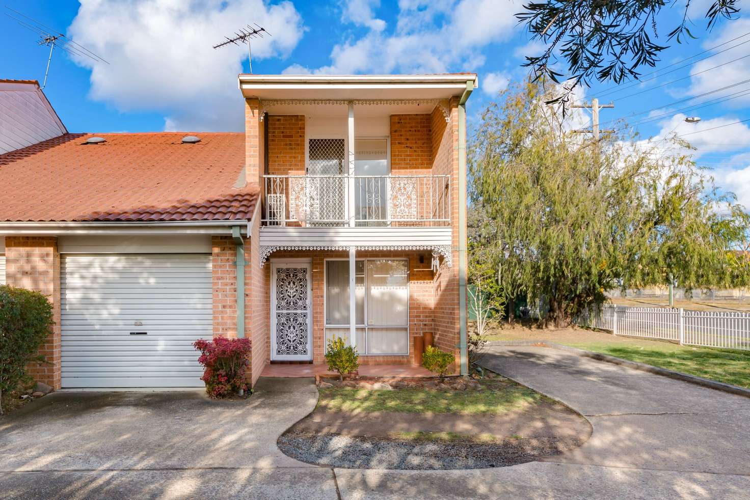 Main view of Homely townhouse listing, 1/12 Parliament Road, Macquarie Fields NSW 2564