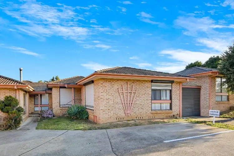 Main view of Homely villa listing, 7/65 Fuchsia Crescent, Macquarie Fields NSW 2564