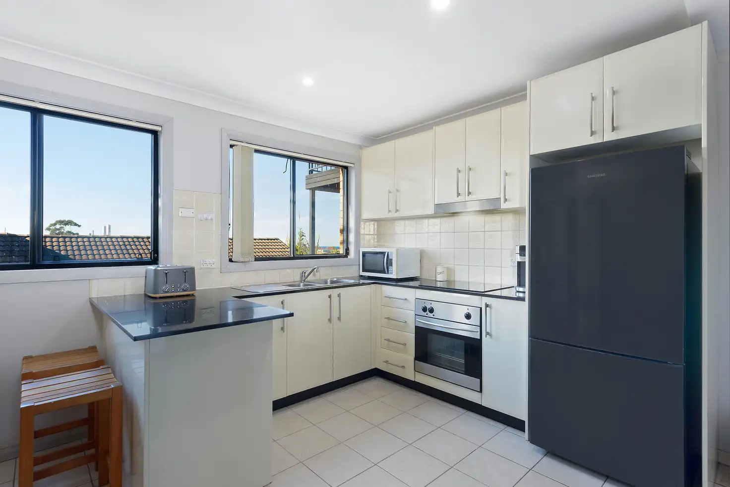 Main view of Homely townhouse listing, 2/6-8 Melinda Grove, Lake Heights NSW 2502