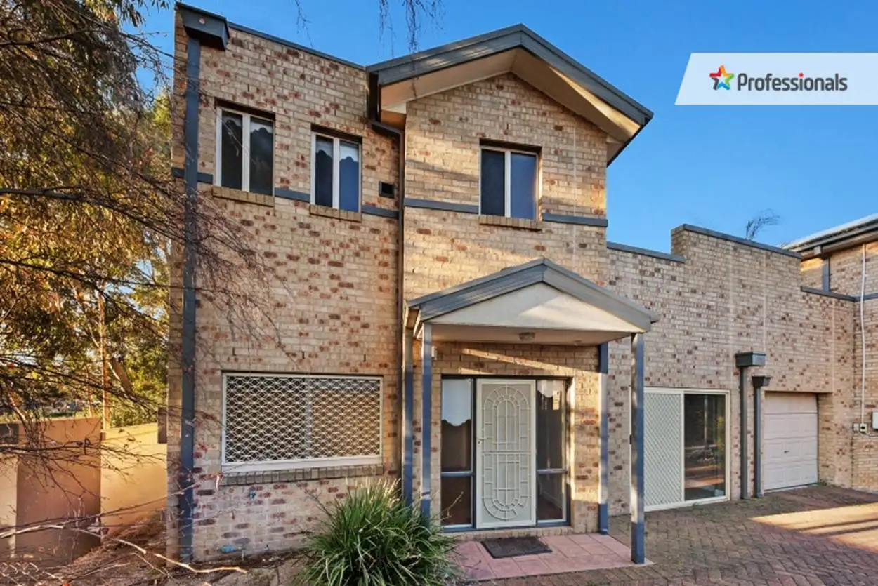 Main view of Homely townhouse listing, 1/2 Lakeside Drive, Sanctuary Lakes VIC 3030