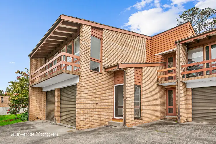 Main view of Homely townhouse listing, 1/8a Northwood Road, Mount Ousley NSW 2519