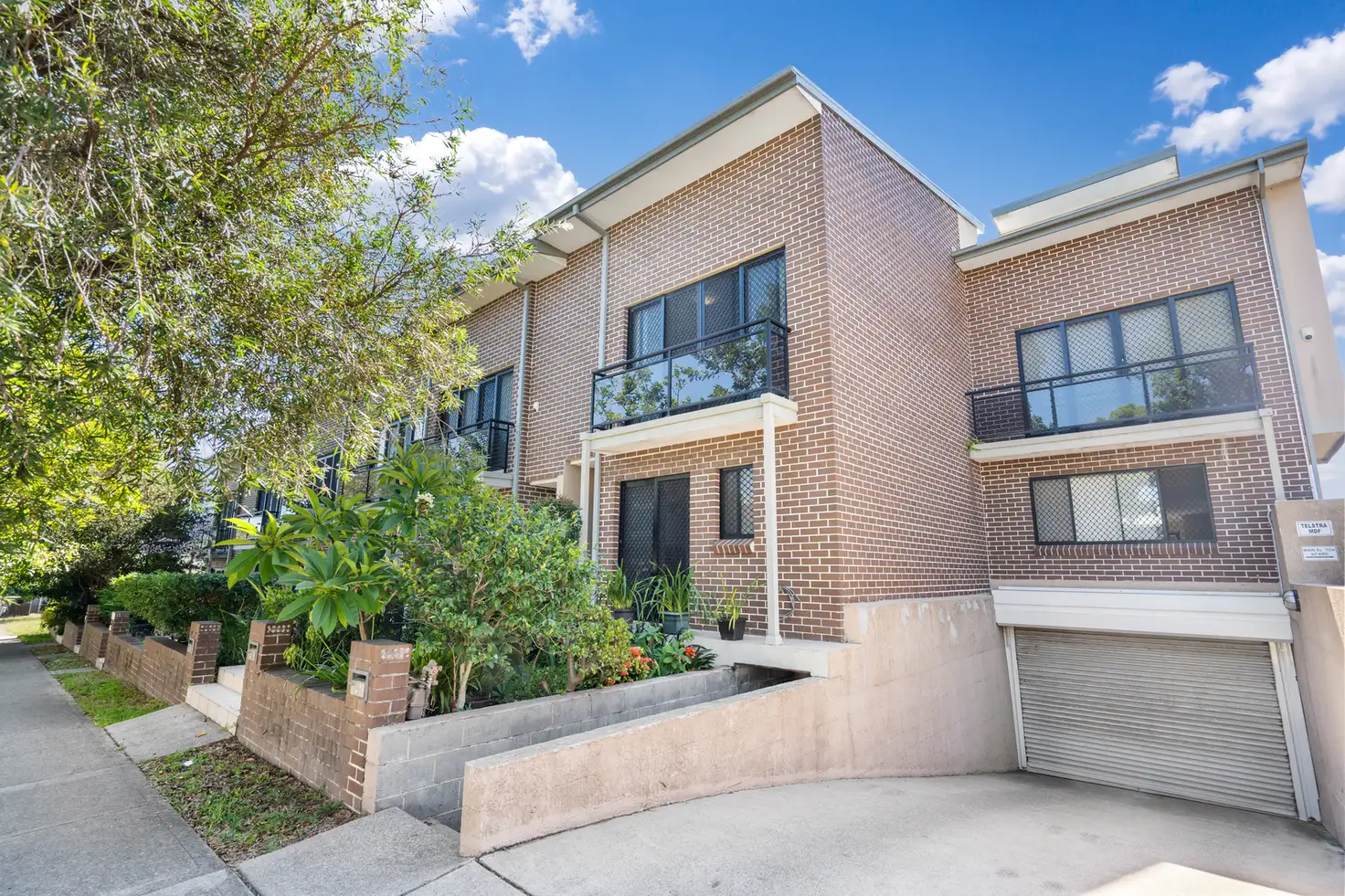 Main view of Homely townhouse listing, 9/11-13 Raglan Road, Auburn NSW 2144