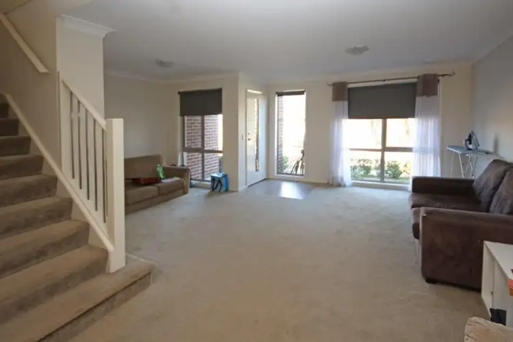 Third view of Homely townhouse listing, 4a Hampshire Boulevard, Spring Farm NSW 2570