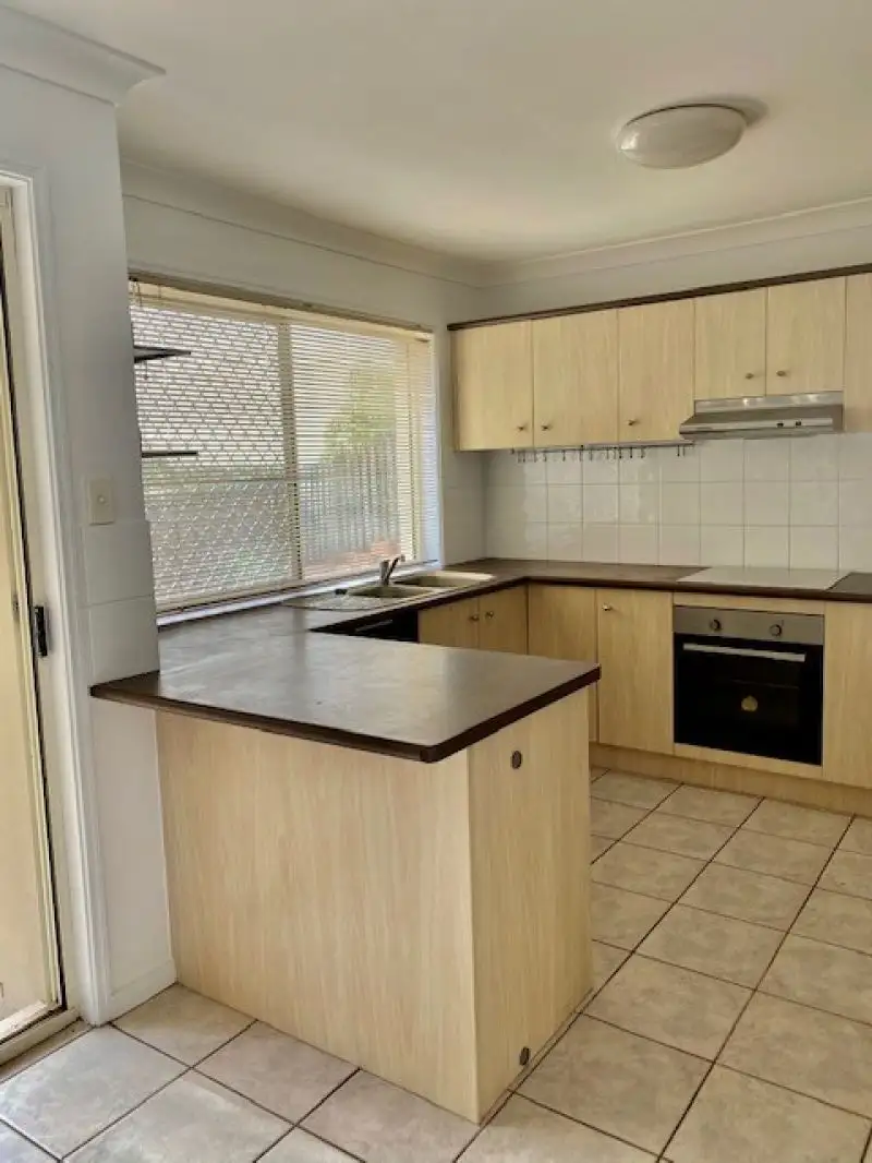 Main view of Homely townhouse listing, 12/74 Universal Street, Pacific Pines QLD 4211