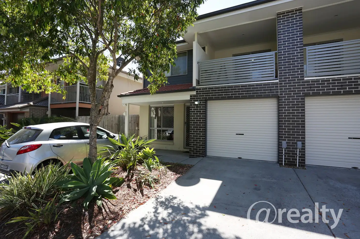 Main view of Homely townhouse listing, 8/131 McAuley Parade, Pacific Pines QLD 4211