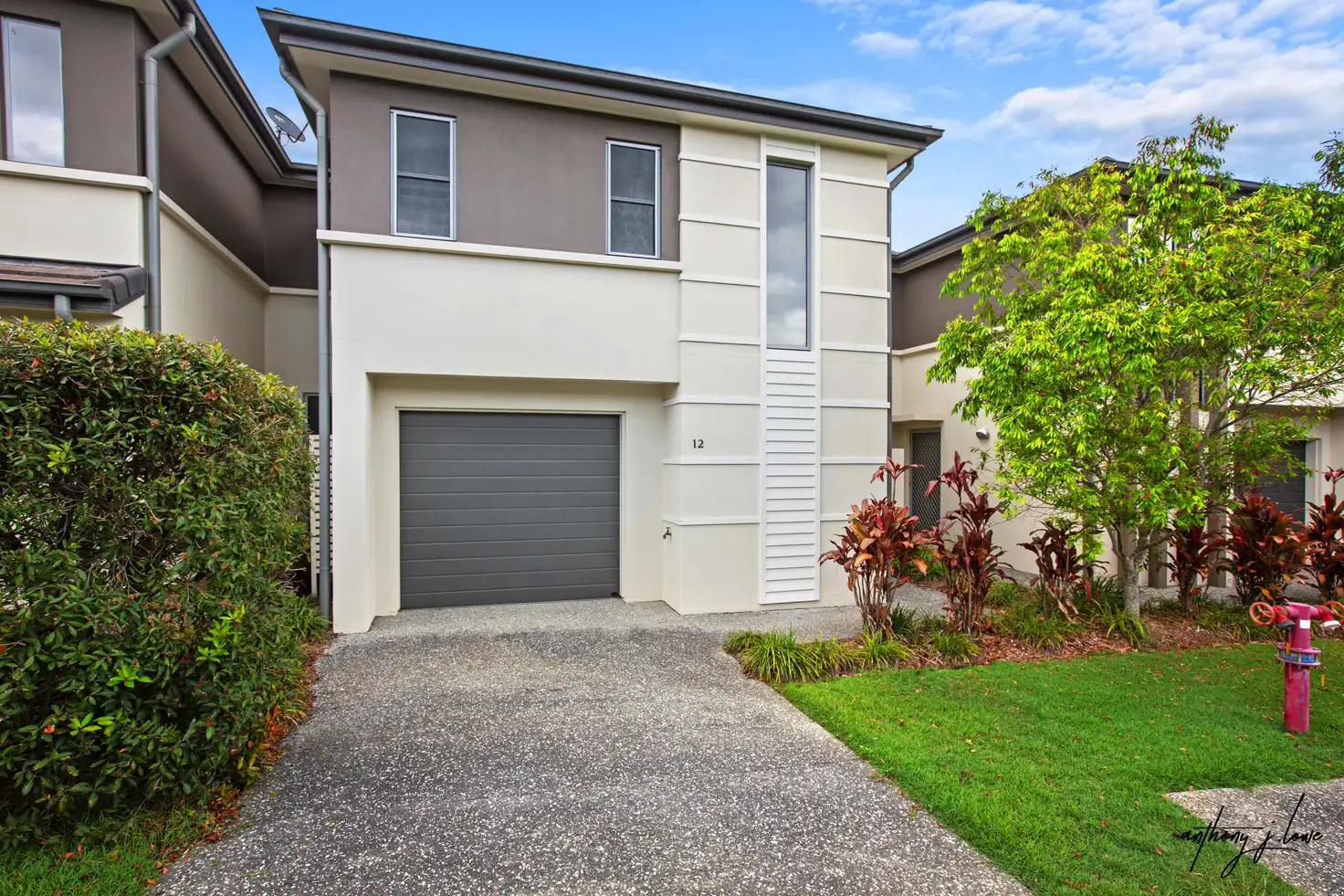 Main view of Homely townhouse listing, Unit 12/1 Belongil St, Pacific Pines QLD 4211