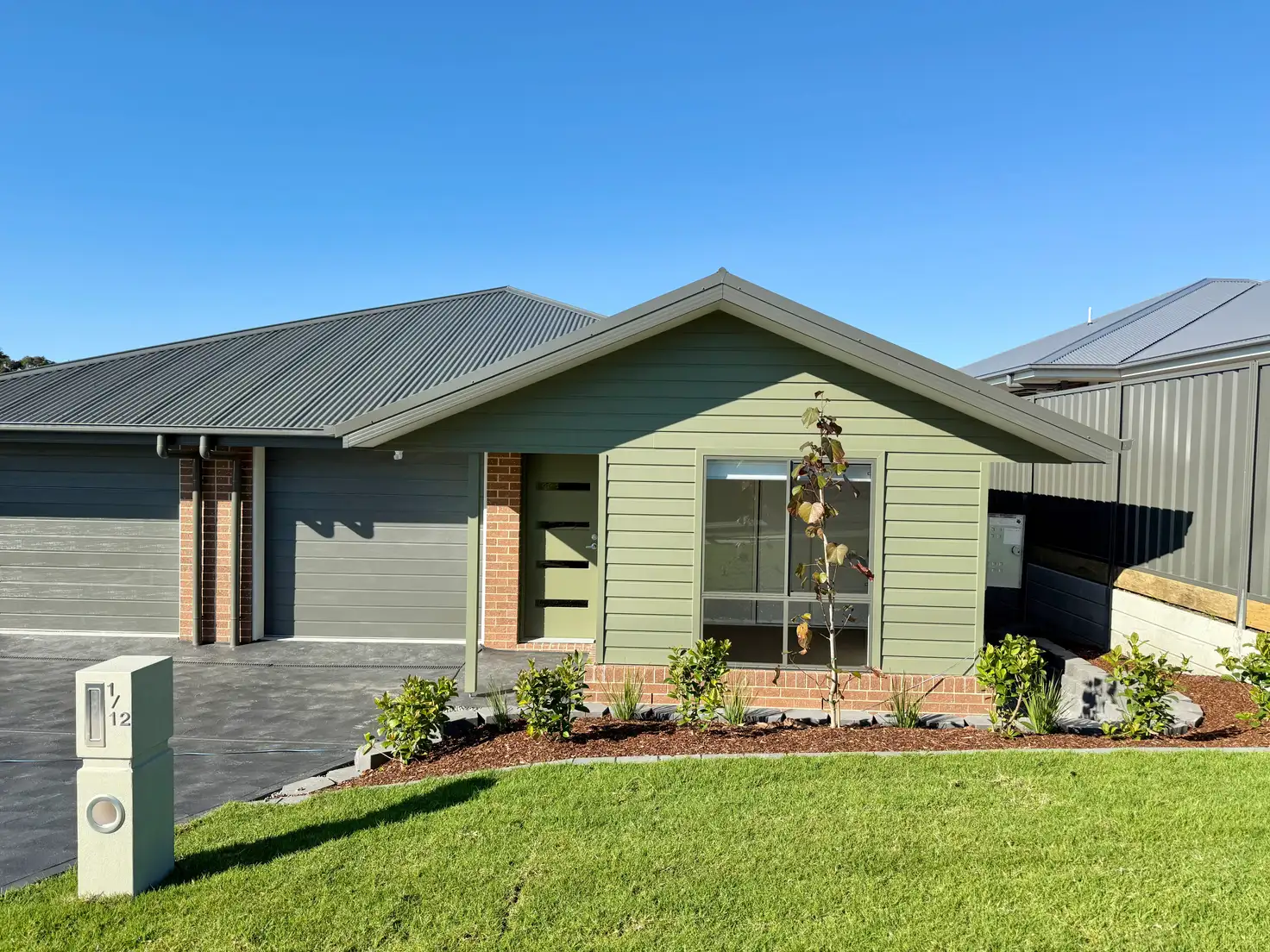 Main view of Homely semi-detached listing, 1/12 Brushworth Drive, Edgeworth NSW 2285