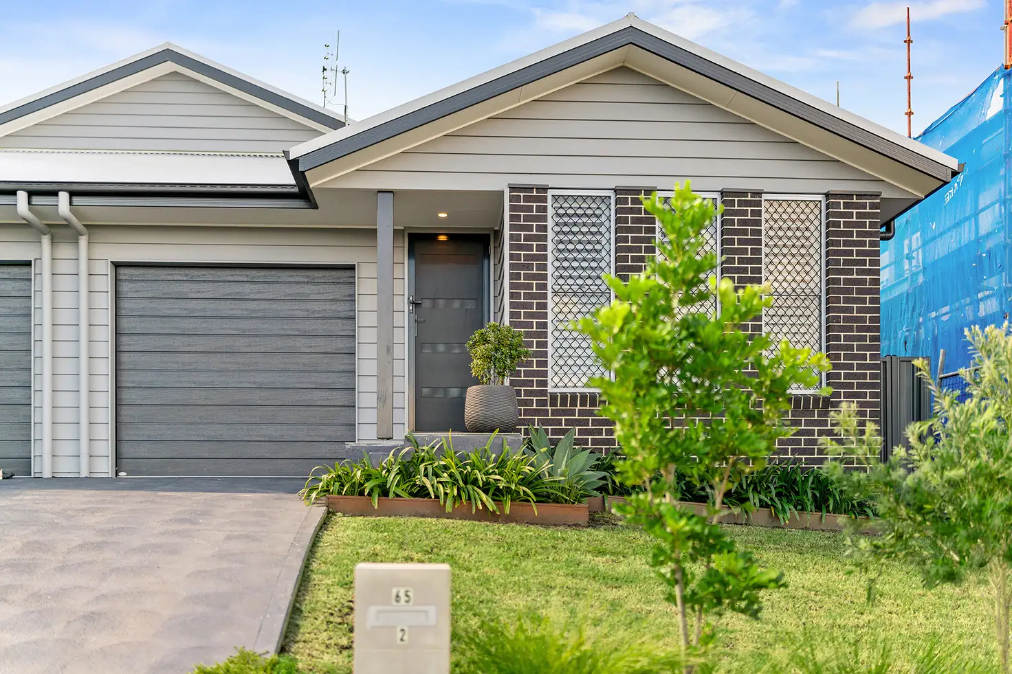 Main view of Homely semi-detached listing, 2/65 Comel Avenue, Cameron Park NSW 2285