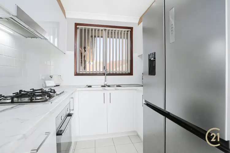 Main view of Homely villa listing, 2/12 Bensley Road, Macquarie Fields NSW 2564