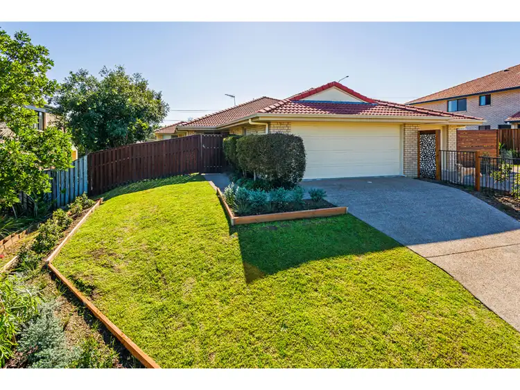Main view of Homely semi-detached listing, 1/23 McRae Cct, Pacific Pines QLD 4211