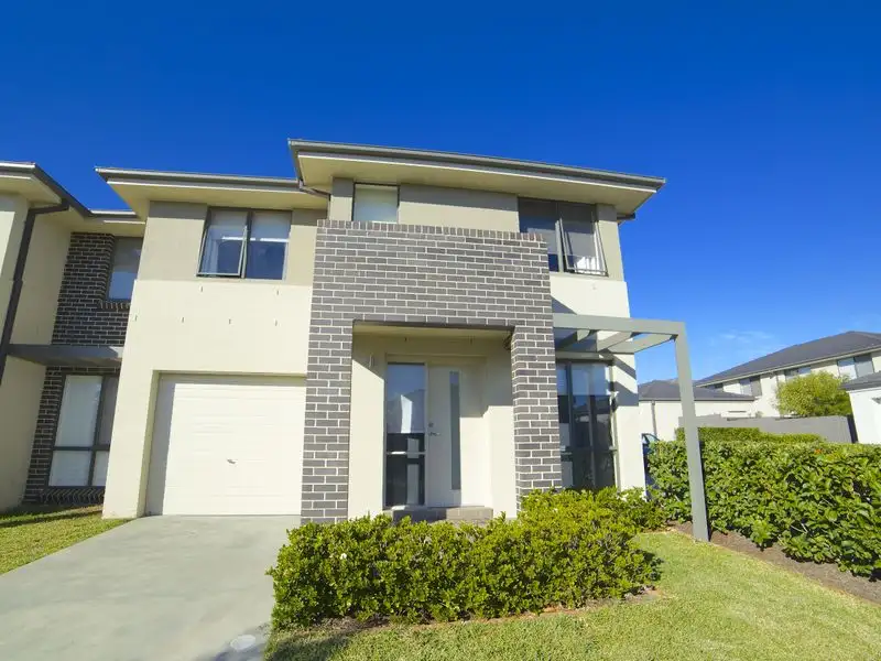 Main view of Homely semi-detached listing, 73 Northampton Drive, Glenfield NSW 2167