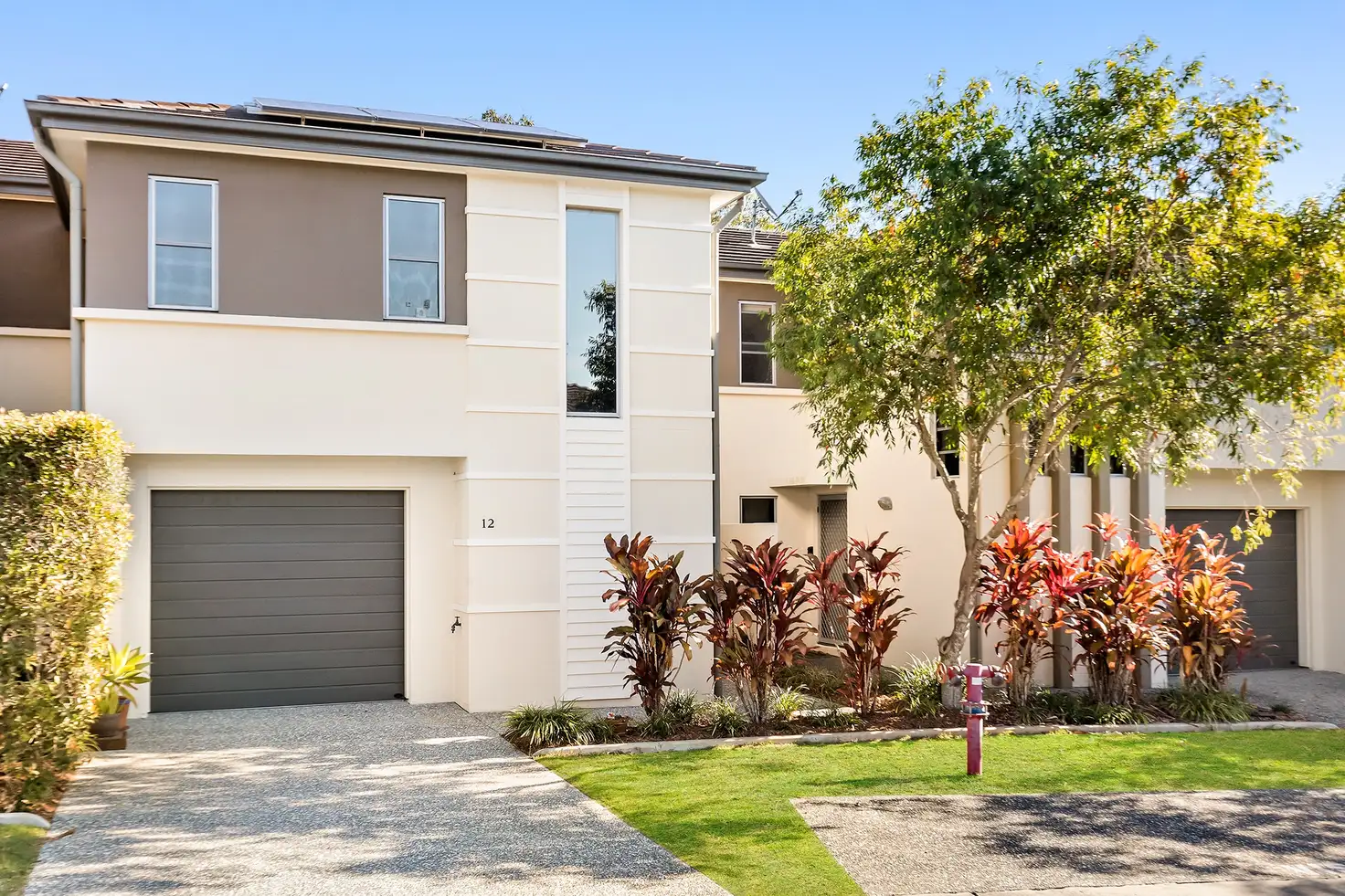 Main view of Homely townhouse listing, 12/1 Belongil Street, Pacific Pines QLD 4211