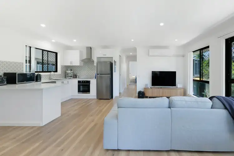 Main view of Homely semi-detached listing, 1/18 Warrie Close, Paradise Point QLD 4216