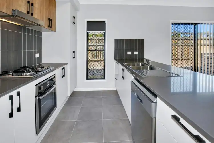 Main view of Homely semi-detached listing, 1/1 Shale Circuit, Cosgrove QLD 4818