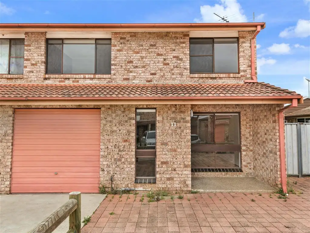 Main view of Homely townhouse listing, 11/31 Calabro Ave, Lurnea NSW 2170