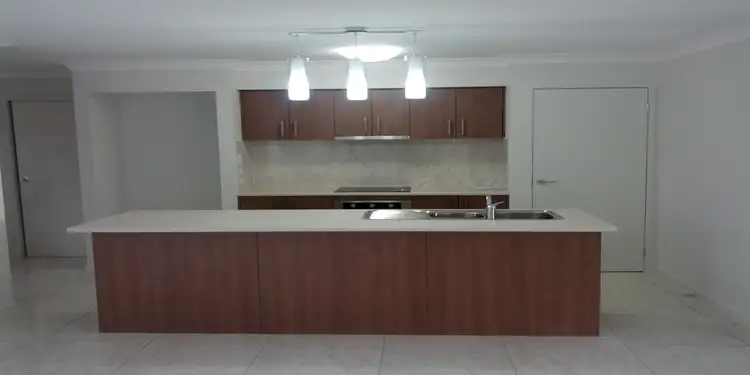 Second view of Homely townhouse listing, 3/133 Wunburra Cir, Pacific Pines QLD 4211