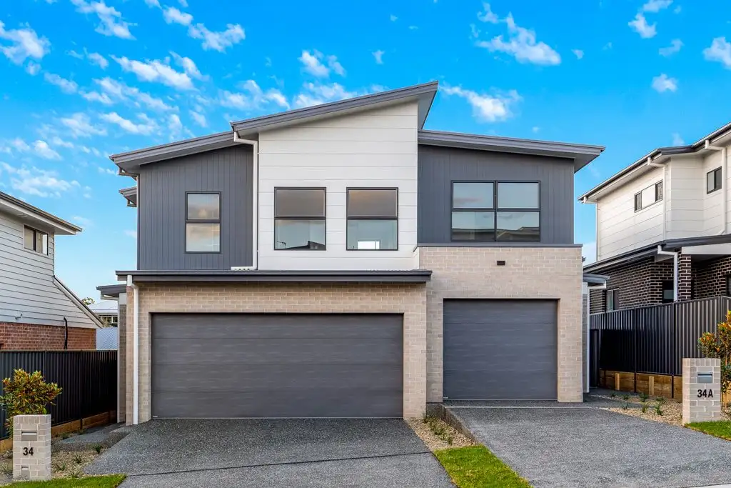Main view of Homely semi-detached listing, 34 Galactic Drive, Dunmore NSW 2529
