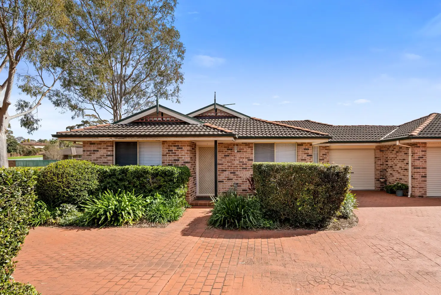Main view of Homely villa listing, 1/10 Azalea Place, Macquarie Fields NSW 2564