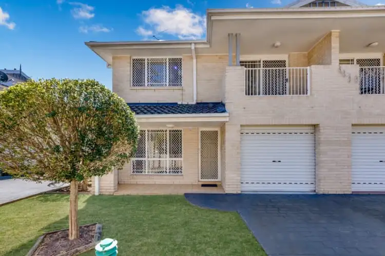 Main view of Homely townhouse listing, 1/15 Cadogan Road, Macquarie Fields NSW 2564