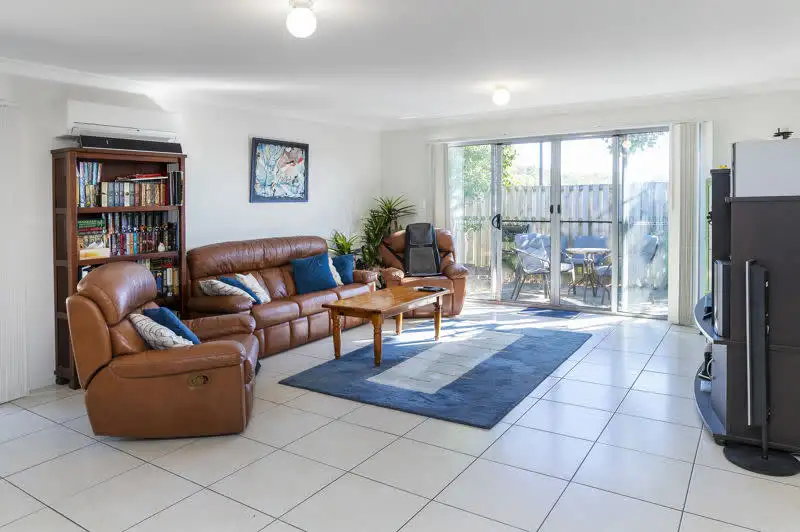 Main view of Homely semi-detached listing, 1/1 Jardine Street, Pacific Pines QLD 4211