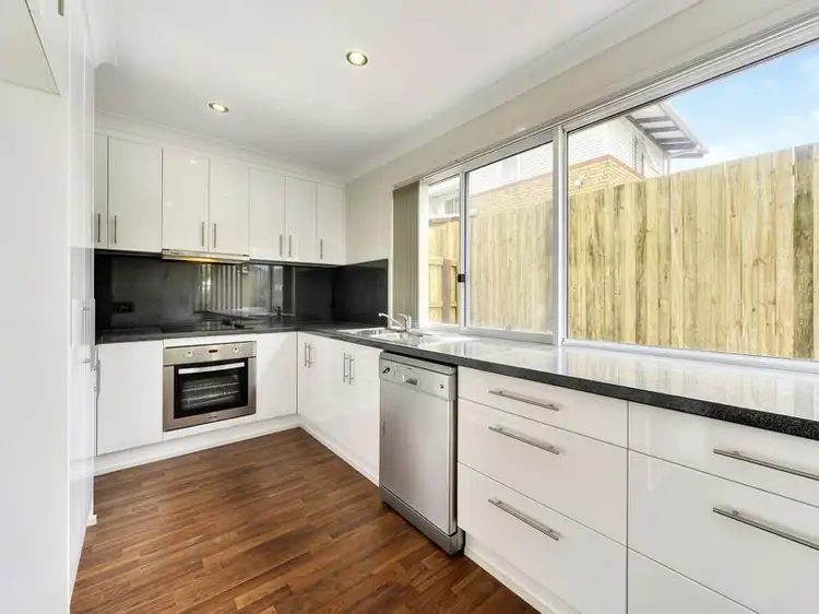 Main view of Homely townhouse listing, 1/21 McAneny St, Redcliffe QLD 4020
