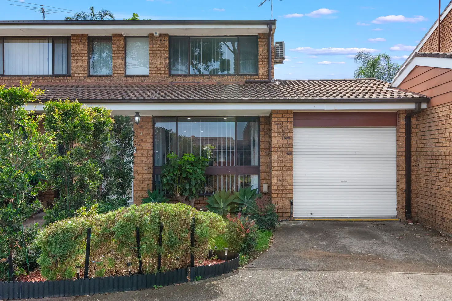 Main view of Homely townhouse listing, 5/201-207 Harrow Road, Glenfield NSW 2167