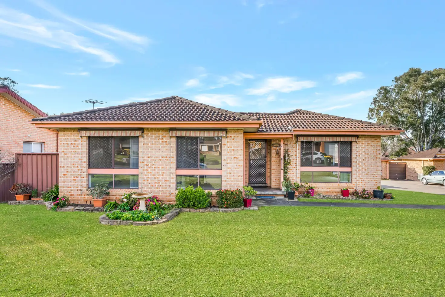 Main view of Homely villa listing, 1/65 Fuchsia Crescent, Macquarie Fields NSW 2564