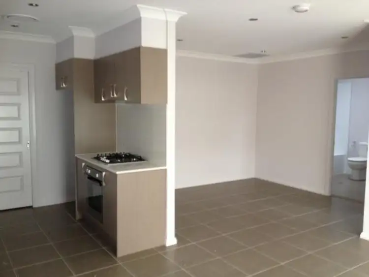 Main view of Homely semi-detached listing, 1A Dewpoint Drive, Spring Farm NSW 2570